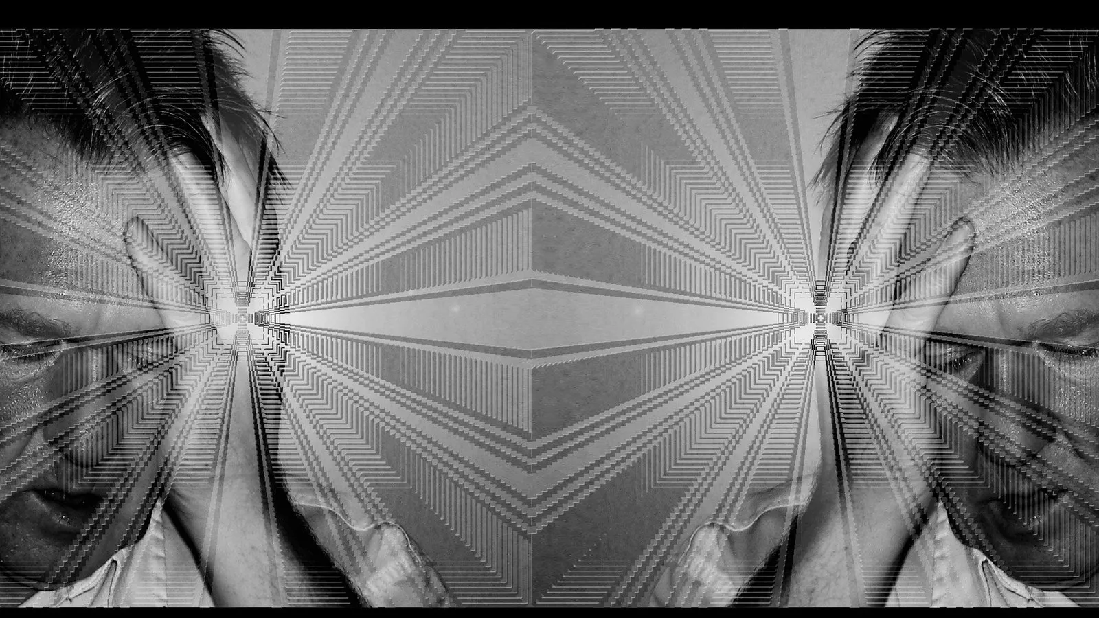 A person lit by screen light, surrounded but alone